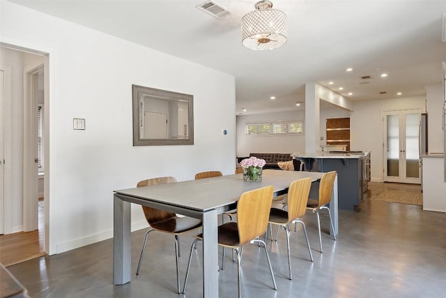 7517 Saint Louis St, Austin, TX 78757 - dining space with recessed lighting, finished concrete flooring, and baseboards