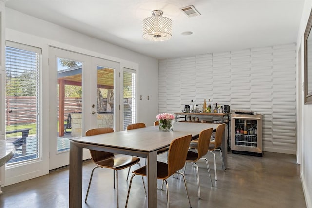 7517 Saint Louis St, Austin, TX 78757 - dining area featuring french doors, plenty of natural light, wine cooler, and baseboards