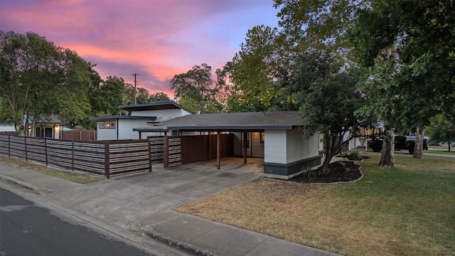 7517 Saint Louis St, Austin, TX 78757 - split level home featuring concrete driveway and an attached carport