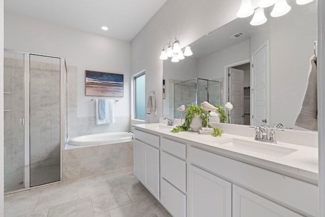9904 Comely Bnd, Manor, TX 78653 - bathroom with double vanity, a shower stall, a bath, and a chandelier
