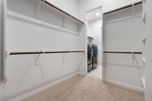 9904 Comely Bnd, Manor, TX 78653 - walk in closet featuring washer and dryer and carpet