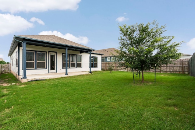 9904 Comely Bnd, Manor, TX 78653 - rear view of house with a fenced backyard and a patio