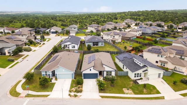 9904 Comely Bnd, Manor, TX 78653 - aerial perspective of suburban area with a heavily wooded area