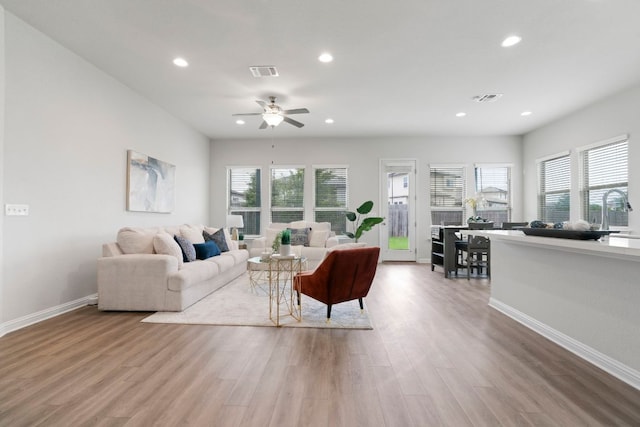 9904 Comely Bnd, Manor, TX 78653 - living area featuring recessed lighting, wood finished floors, and a ceiling fan