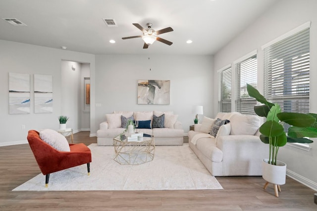 9904 Comely Bnd, Manor, TX 78653 - living area featuring wood finished floors, a ceiling fan, and recessed lighting