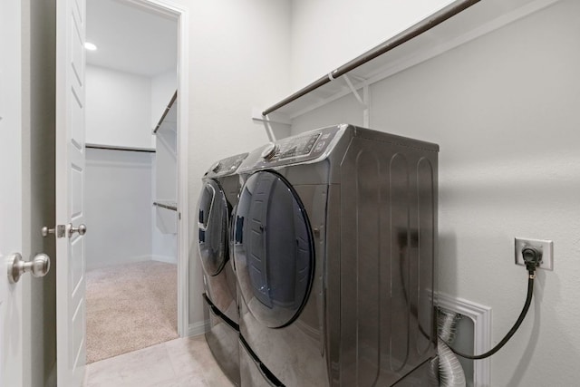 9904 Comely Bnd, Manor, TX 78653 - laundry room featuring washing machine and dryer and light carpet