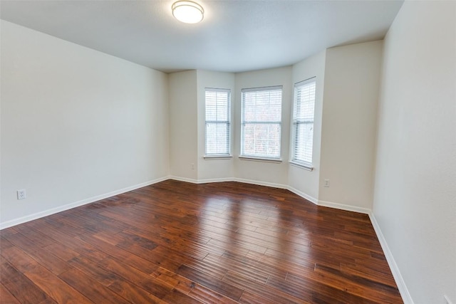 480 Middle Crk, Buda, TX 78610 - unfurnished room with dark wood-type flooring and baseboards