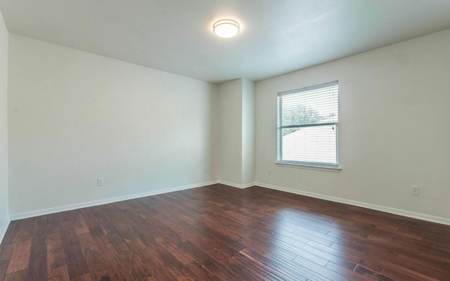 480 Middle Crk, Buda, TX 78610 - spare room with dark wood-type flooring and baseboards
