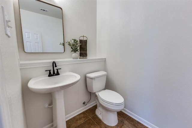 480 Middle Crk, Buda, TX 78610 - bathroom featuring toilet, tile patterned flooring, and baseboards