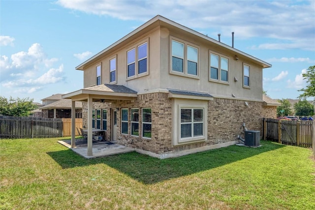1317 Gaviota Ln, Leander, TX 78641 - rear view of property with a patio, a fenced backyard, stucco siding, and brick siding