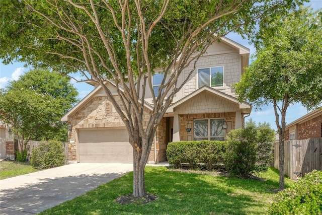 1317 Gaviota Ln, Leander, TX 78641 - view of front of property featuring stone siding, an attached garage, and driveway