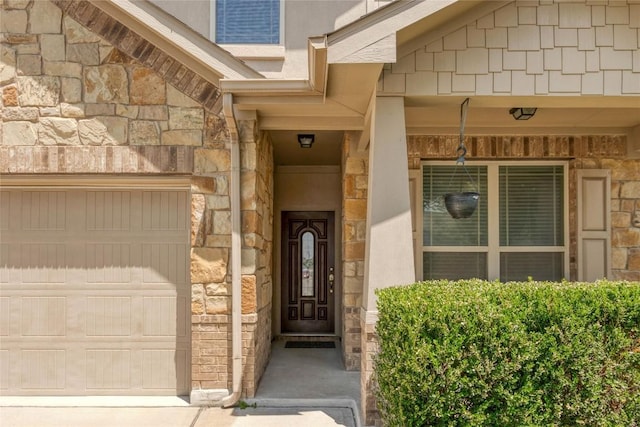 1317 Gaviota Ln, Leander, TX 78641 - property entrance with stone siding and a garage