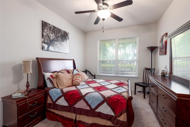 1317 Gaviota Ln, Leander, TX 78641 - bedroom featuring light carpet, multiple windows, and a ceiling fan