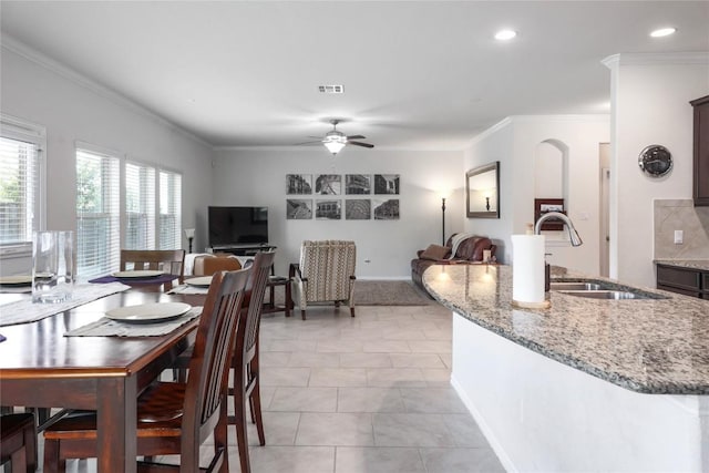 1317 Gaviota Ln, Leander, TX 78641 - dining room with ornamental molding, recessed lighting, ceiling fan, light tile patterned flooring, and baseboards