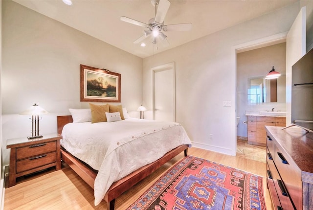 555 E 5th St Unit 809, Austin, TX 78701 - bedroom featuring light wood finished floors, baseboards, and recessed lighting