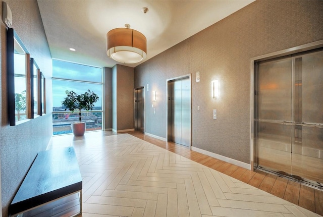 555 E 5th St Unit 809, Austin, TX 78701 - corridor featuring elevator and baseboards