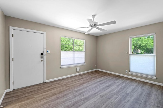3105 Steck Ave, Austin, TX 78757 - entryway featuring plenty of natural light, wood finished floors, ceiling fan, and baseboards