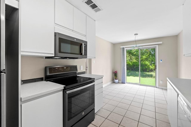 3105 Steck Ave, Austin, TX 78757 - kitchen with appliances with stainless steel finishes, baseboards, white cabinetry, light countertops, and light tile patterned floors