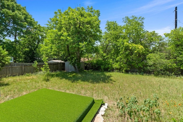 3105 Steck Ave, Austin, TX 78757 - fenced backyard with a storage unit