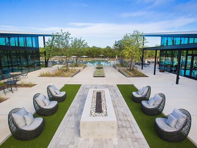 8604 Endale Arch Dr, Austin, TX 78744 - surrounding community with a fire pit