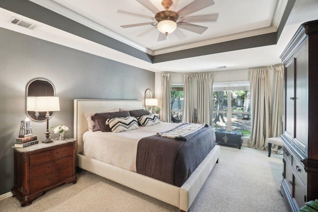 20737 Kearney Hill Rd, Pflugerville, TX 78660 - bedroom with crown molding, light colored carpet, a tray ceiling, and ceiling fan