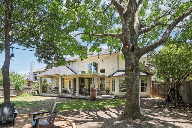 20737 Kearney Hill Rd, Pflugerville, TX 78660 - rear view of house featuring a fenced backyard and a patio area