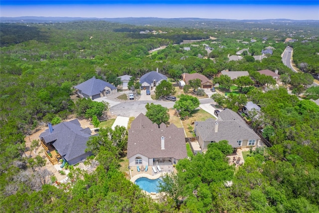 7 Redwood Cir, Wimberley, TX 78676 - view of property location featuring a pool, a forest, and nearby suburban area