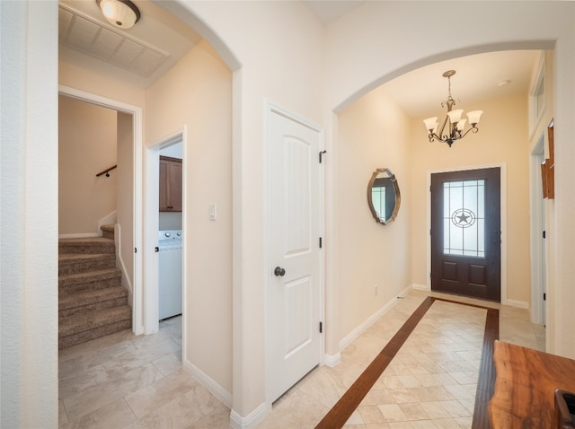7 Redwood Cir, Wimberley, TX 78676 - foyer featuring a chandelier, stairway, arched walkways, and baseboards