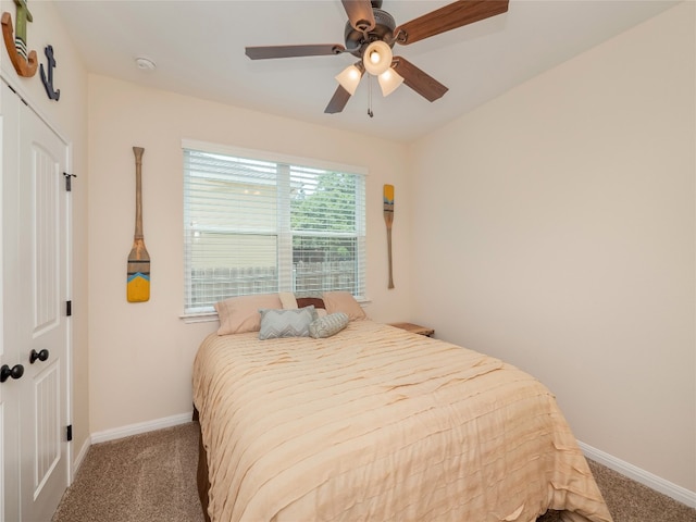 7 Redwood Cir, Wimberley, TX 78676 - carpeted bedroom with baseboards and a ceiling fan