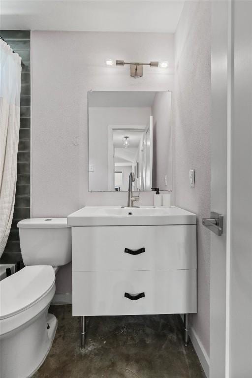 1514 Turtle Creek Blvd, Austin, TX 78745 - full bath with vanity, toilet, unfinished concrete flooring, baseboards, and a shower with shower curtain