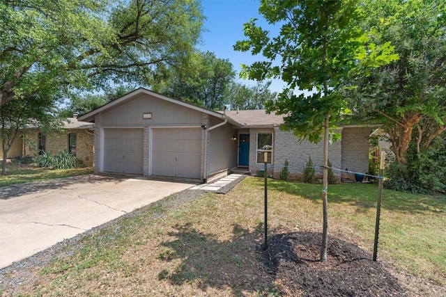 1514 Turtle Creek Blvd, Austin, TX 78745 - single story home featuring an attached garage, stone siding, a front lawn, and concrete driveway