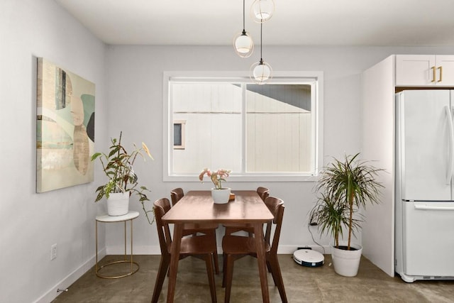 1514 Turtle Creek Blvd, Austin, TX 78745 - dining space featuring baseboards and concrete flooring