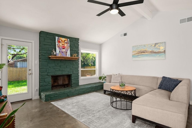 1514 Turtle Creek Blvd, Austin, TX 78745 - living area with healthy amount of natural light, finished concrete floors, beam ceiling, ceiling fan, and a stone fireplace