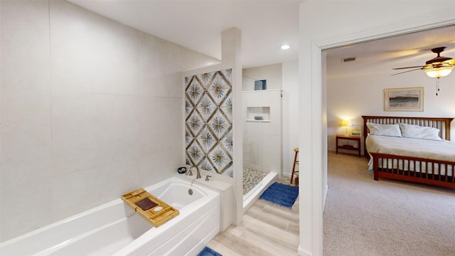 4006 Spanish Oak Ln, Dripping Springs, TX 78620 - ensuite bathroom with a garden tub, tiled shower, a ceiling fan, and recessed lighting