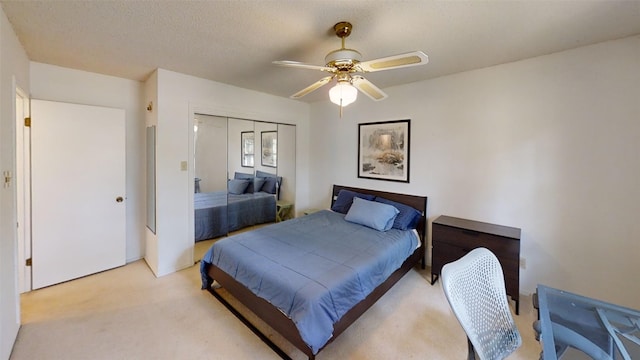 4006 Spanish Oak Ln, Dripping Springs, TX 78620 - bedroom with light colored carpet, a closet, and a ceiling fan