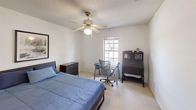 4006 Spanish Oak Ln, Dripping Springs, TX 78620 - bedroom featuring light colored carpet, a textured ceiling, and a ceiling fan
