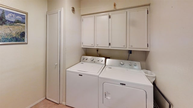 4006 Spanish Oak Ln, Dripping Springs, TX 78620 - laundry area featuring washer and clothes dryer, cabinet space, baseboards, and light tile patterned flooring