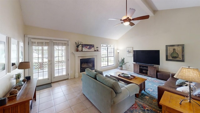 4006 Spanish Oak Ln, Dripping Springs, TX 78620 - living area featuring french doors, a ceiling fan, beam ceiling, light tile patterned flooring, and high vaulted ceiling