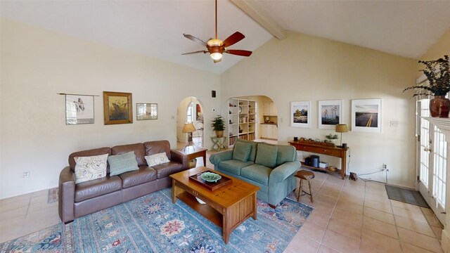 4006 Spanish Oak Ln, Dripping Springs, TX 78620 - living room with ceiling fan, arched walkways, beam ceiling, light tile patterned floors, and high vaulted ceiling