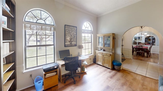 4006 Spanish Oak Ln, Dripping Springs, TX 78620 - office area featuring a chandelier, plenty of natural light, light wood-type flooring, ornamental molding, and a towering ceiling