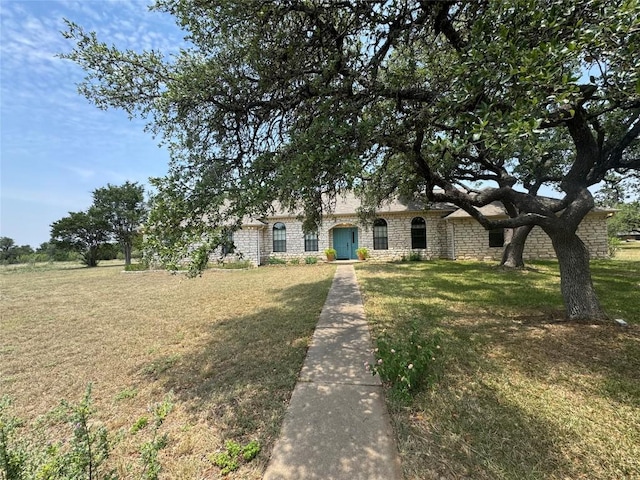 4006 Spanish Oak Ln, Dripping Springs, TX 78620 - view of front facade with stone siding and a front lawn