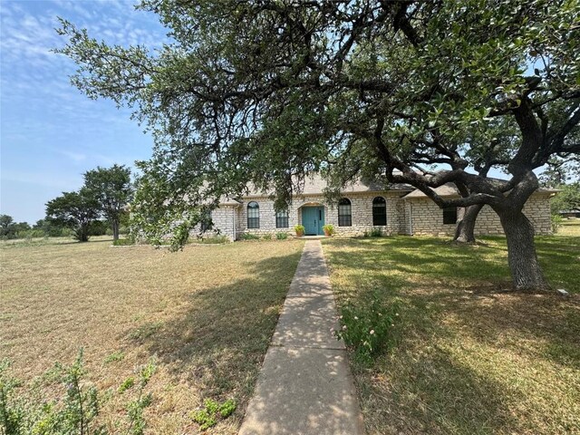4006 Spanish Oak Ln, Dripping Springs, TX 78620 - view of front facade with stone siding and a front yard