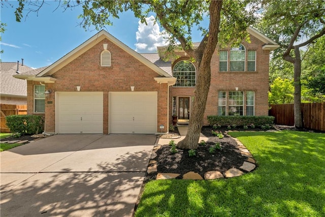 traditional-style home with an attached garage, concrete driveway, and brick siding