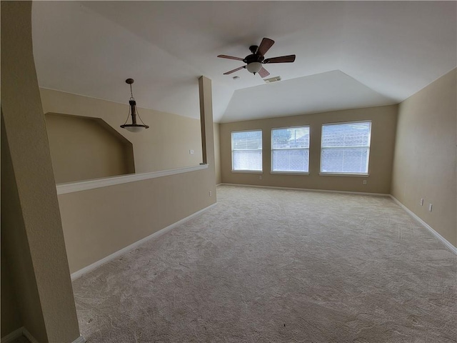 spare room with a ceiling fan, carpet flooring, and baseboards