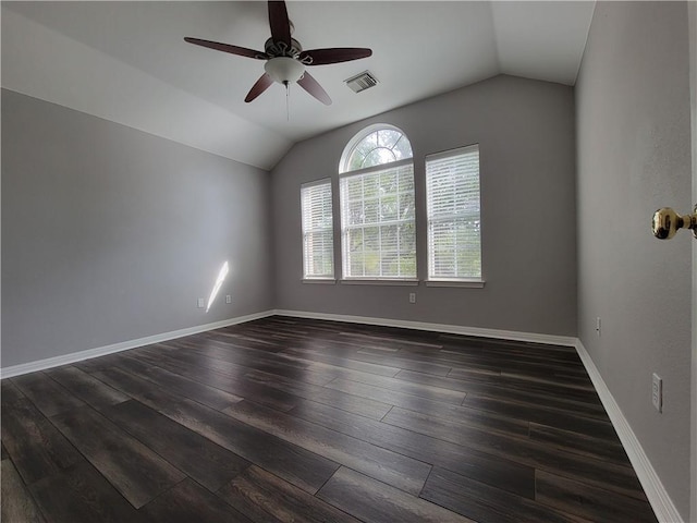 unfurnished room with lofted ceiling, dark wood finished floors, ceiling fan, and baseboards