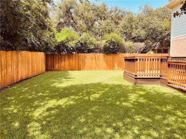 view of yard with a wooden deck