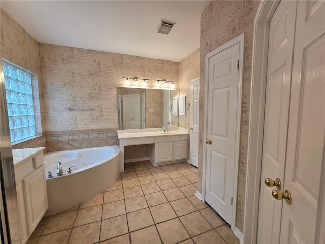 1411 Hunter Ace Way, Cedar Park, TX 78613 - full bathroom featuring vanity, tile patterned flooring, a tub with jets, and a closet