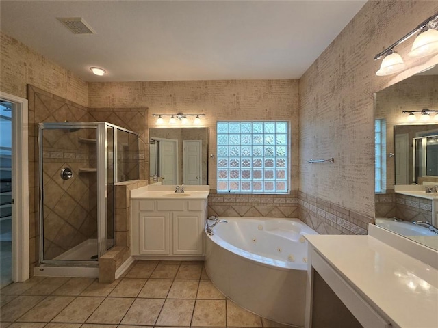1411 Hunter Ace Way, Cedar Park, TX 78613 - full bathroom featuring tile patterned flooring, a jetted tub, a stall shower, and two vanities