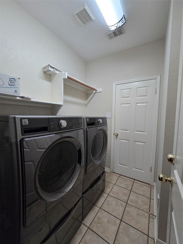 1411 Hunter Ace Way, Cedar Park, TX 78613 - laundry room featuring washing machine and clothes dryer and light tile patterned floors