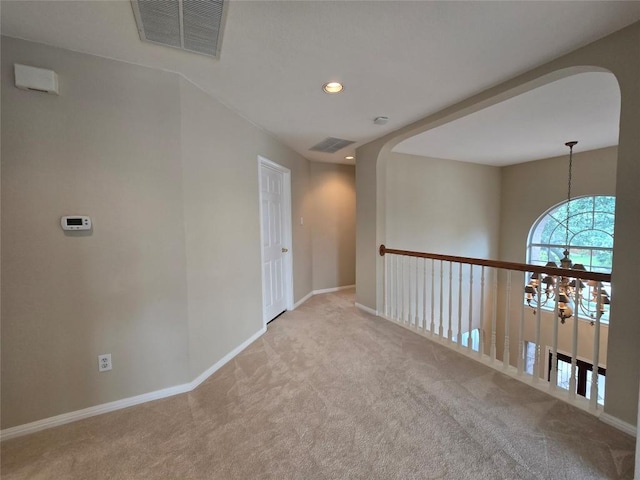1411 Hunter Ace Way, Cedar Park, TX 78613 - empty room with carpet floors, recessed lighting, arched walkways, a chandelier, and a smoke detector
